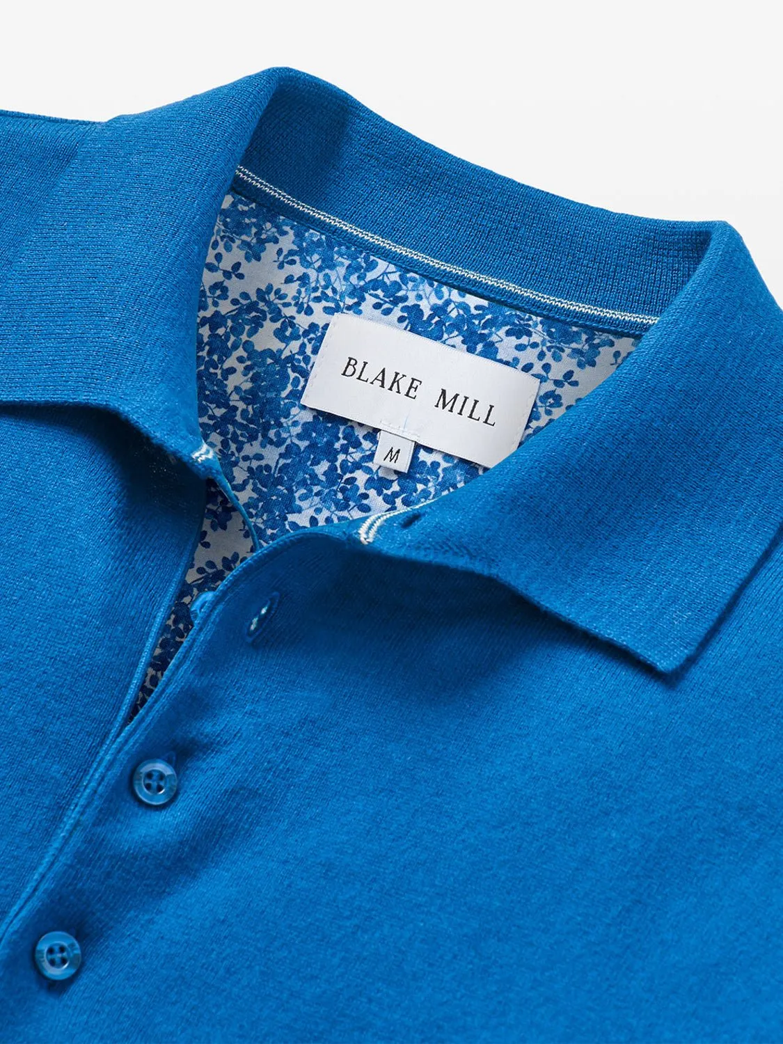 Blue Knit Polo with Blossom Accents